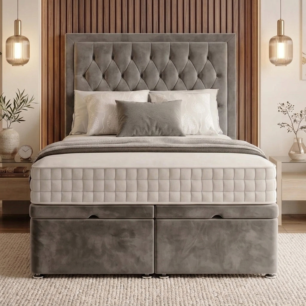 A gray tufted velvet bed frame with a diamond-patterned headboard and two storage drawers underneath, styled with white and gray bedding in a modern bedroom setting.