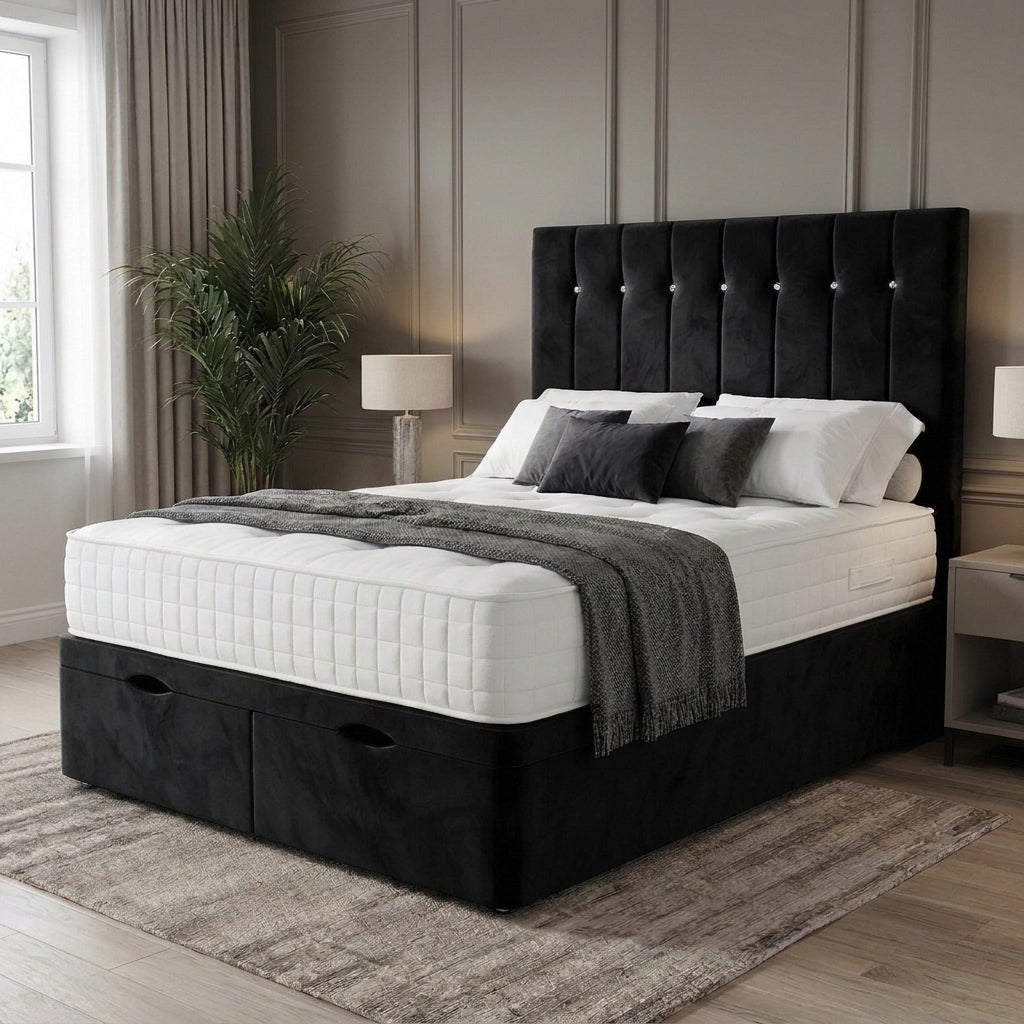 A black upholstered bed frame with a tall button-tufted headboard and storage drawers at the base, shown in a styled bedroom setting with white bedding, gray throw blanket, lamps, curtains, and a rug.