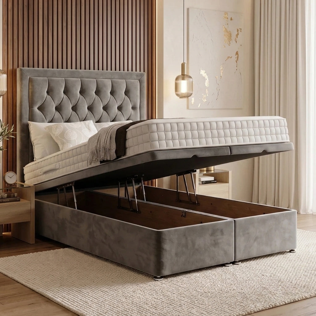 A gray upholstered bed frame with a raised mattress, shown in a modern bedroom setting with wood slat paneling, a hanging pendant light, and a neutral rug.